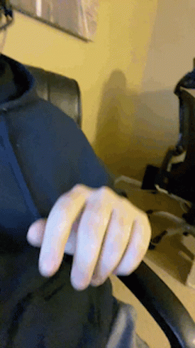 Close-Up Hand In Black Shirt GIF