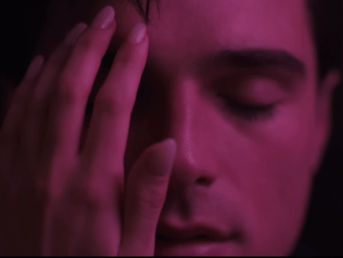 Close Up Man Eyes Closed Hand on Forehead