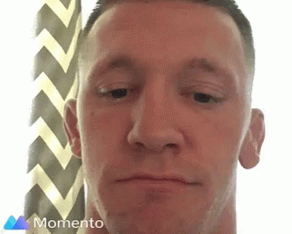Close Up Man Face With Momento Logo