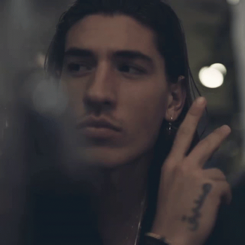 Close Up Man Face With Tattoo Saying A