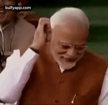 Close-Up Man's Ear And Hand GIF