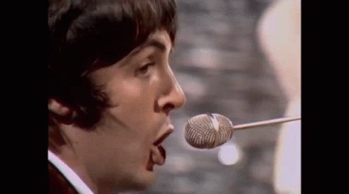 Close Up Man Singing Into Microphone