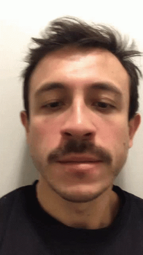 Close Up Man With Mustache in Black Shirt