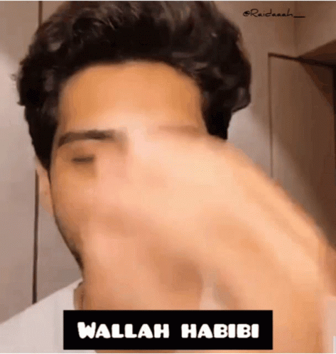 Close Up Man With Wallah Habibi Sign