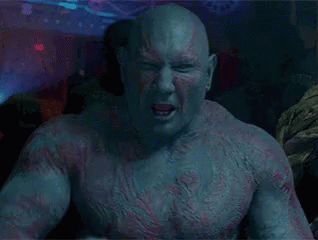 Close Up Muscular Bald Man With Beard