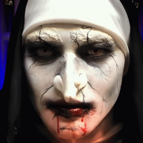 Close Up Nun Face With Blood