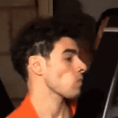 Close Up Of A Man's Face With Black Background GIF