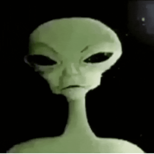 Close Up of Alien Face with Black Eyes