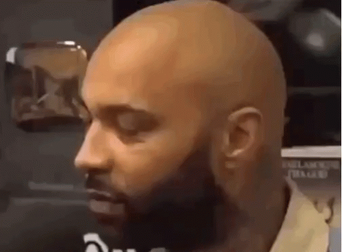 Close-up of Bald Bearded Man