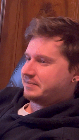 Close Up of Bearded Man with Ear Piercings