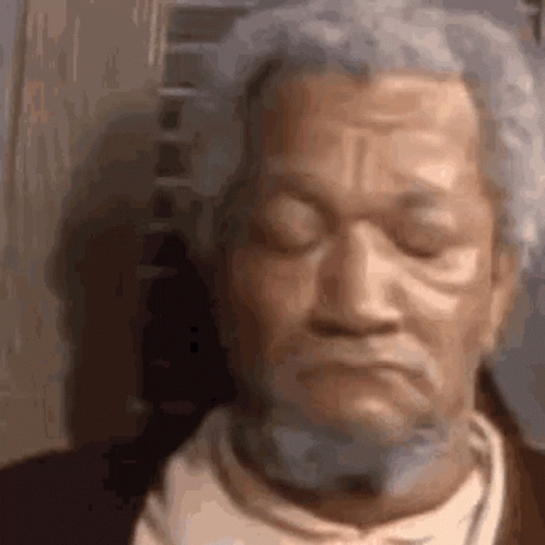 Close Up of Bearded Old Man Statue