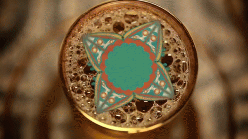 Close Up Of Beer Glass With Floral Design GIF