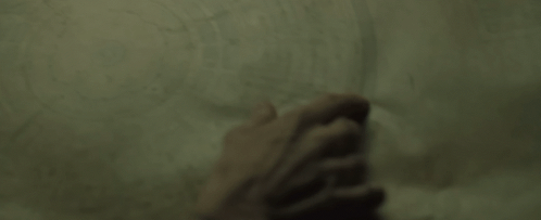 Close Up of Hand Pointing at Paper