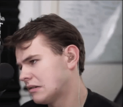 Close Up of Man Face With Ear Buds