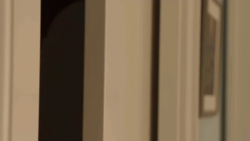 Close Up of Man Looking Out Doorway