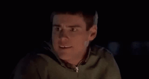 Close Up of Man Making Funny Face in Dark Room
