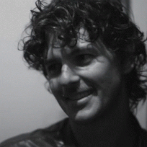 Close Up of Man's Curly Hair Face