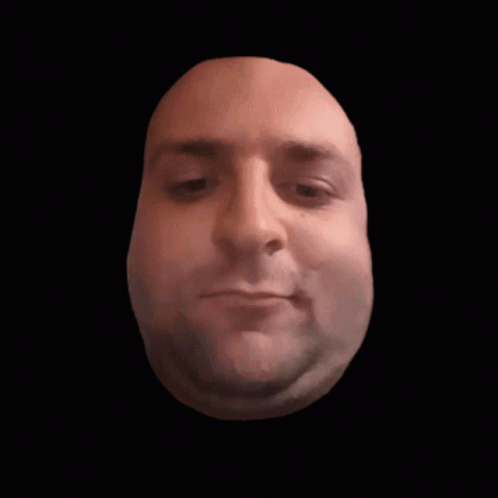 Close Up Of Man's Face Against Black Backdrop GIF