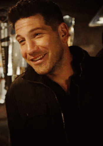 Close Up Of Man's Face In Black Jacket GIF