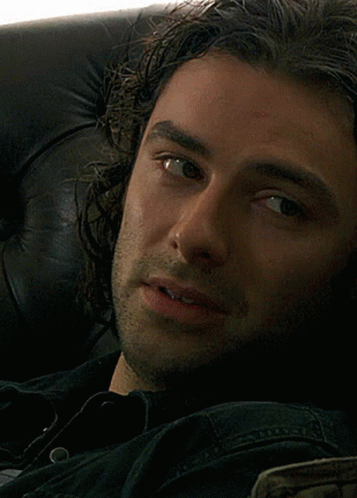 Close Up of Man's Face in Black Shirt