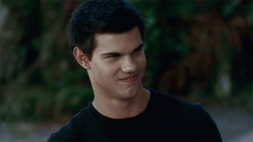 Close Up Of Man's Face In Black Shirt GIF