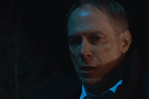 Close Up of Man's Face in Dark Room