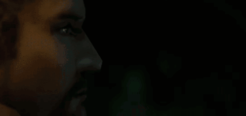 Close Up Of Man's Face In Dark Room GIF