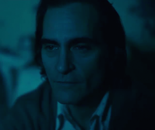 Close Up of Man's Face in Dark With Blue Background
