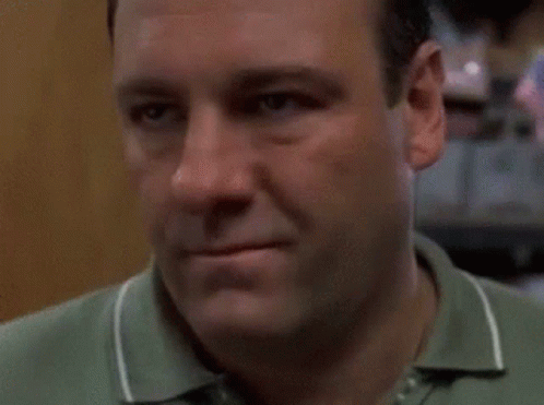 Close Up Of Man's Face In Green Shirt GIF
