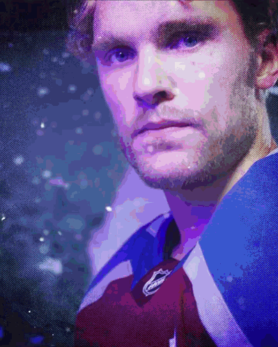 Close Up of Man's Face in Purple and Blue Jersey