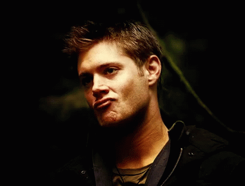 Close Up Of Man's Face In The Dark GIF