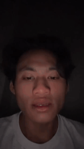Close Up of Man's Face in White Shirt