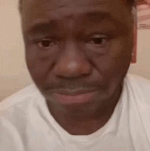Close Up of Man's Face in White Shirt