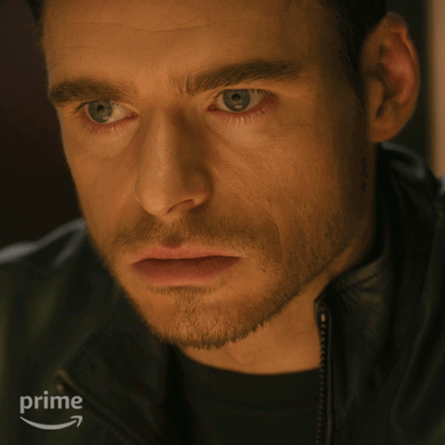 Close Up Of Man's Face With Amazon Prime Logo GIF
