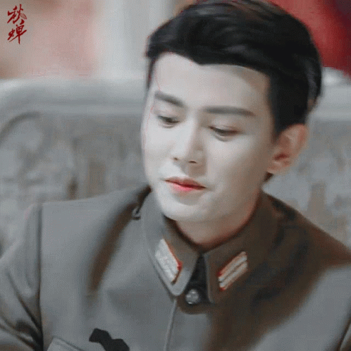Close Up of Man's Face with Chinese Writing
