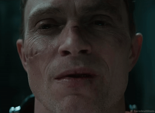 Close Up of Man's Face with Daredevil Shots Logo
