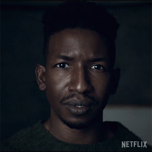 Close Up Of Man's Face With Netflix Logo GIF