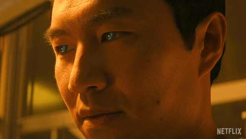 Close Up of Man's Face With Netflix Logo