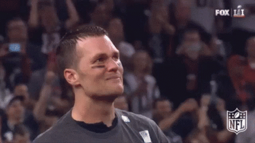 Close Up Of Man's Face With NFL Logo In Background GIF
