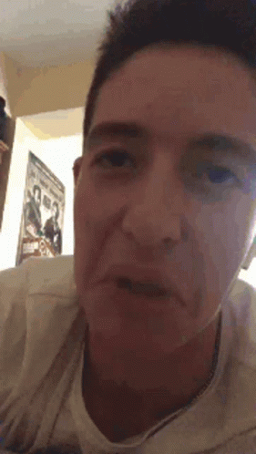 Close Up of Man's Face With Poster