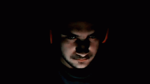 Close Up Of Man's Face With Red Light GIF