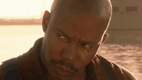 Close Up of Man's Face with Sun Behind