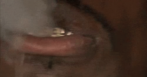 Close Up of Man's Mouth With Ring Saying I Need Money