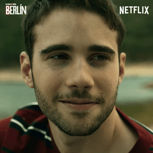 Close Up of Man With Netflix Logo in Background