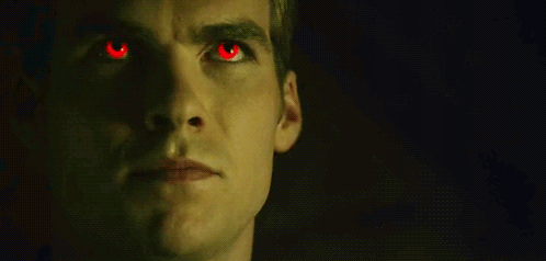Close Up of Man With Red Eyes in the Dark