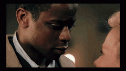 Close Up Of Man With Woman Behind Him GIF
