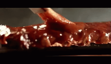 Close Up of Meat Covered in Sauce