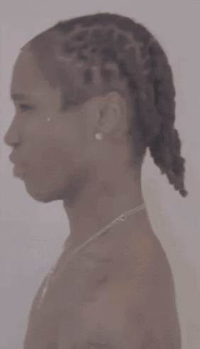 Close Up Of Neck With Braids And Necklace GIF