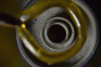 Close Up of Oil Bottle With Yellow Liquid