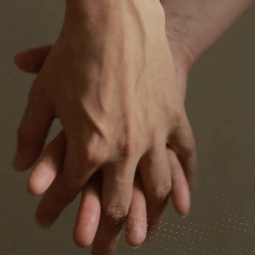 Close Up Of People Holding Hands GIF